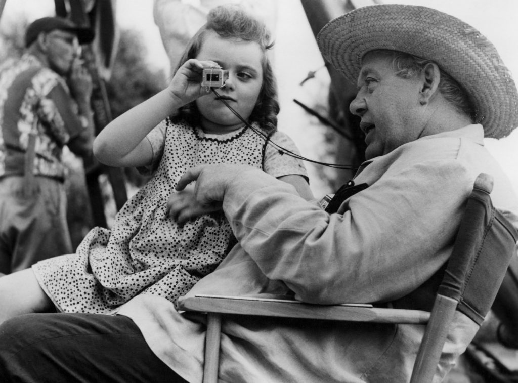 Behind the scenes photo from THE NIGHT OF THE HUNTER with Charles Laughton and Sally Jane Bruce.