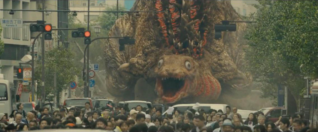 Shin Godzilla in its second form, blasting down a Tokyo street.