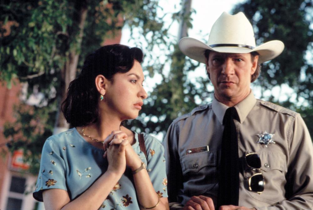 Elizabeth Pena and Chris Cooper in LONE STAR.